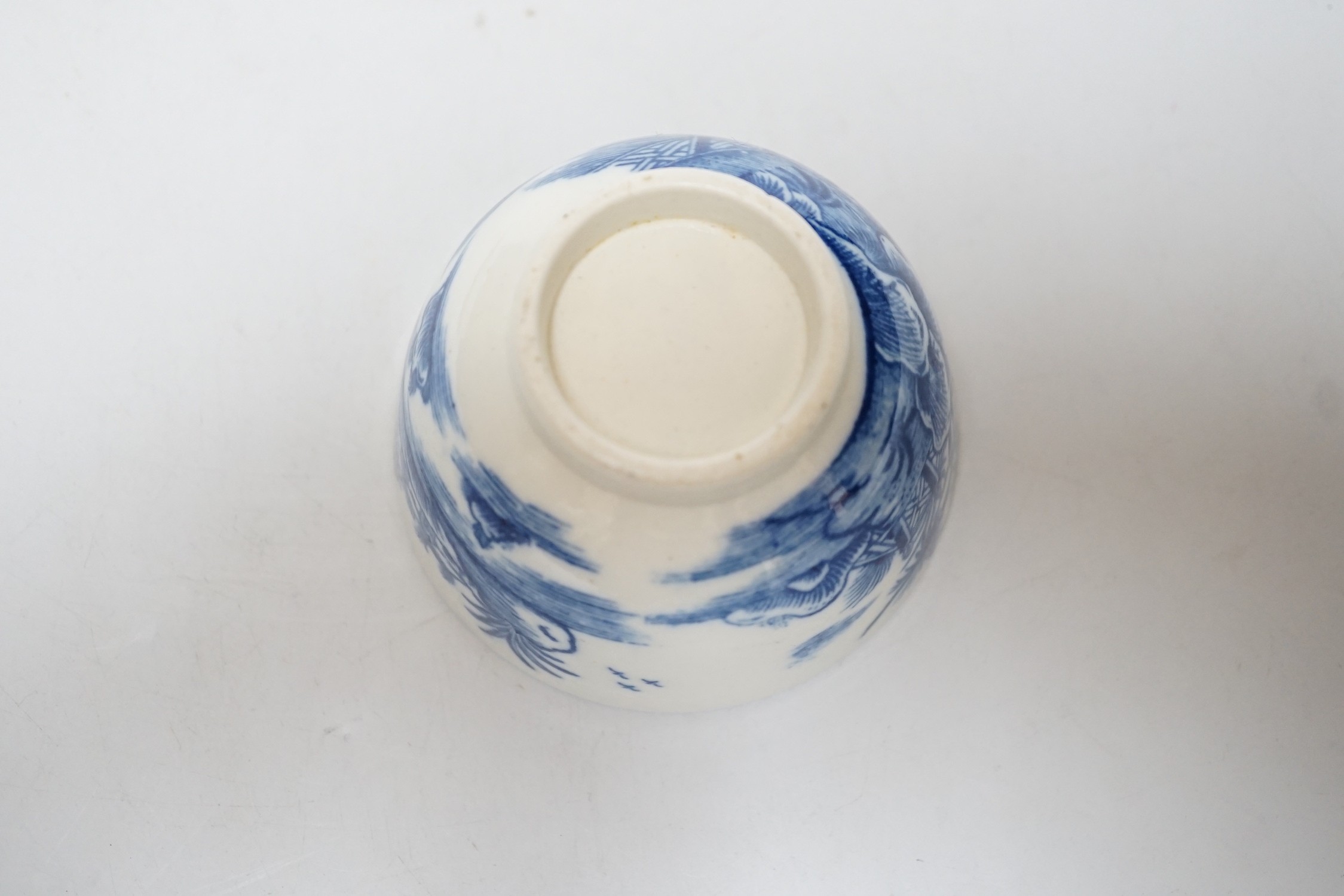 An 18th century Caughley teabowl and saucer printed with the uncommon Fence and House pattern. 6cm tall overall